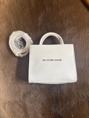 "End Systemic Racism" White Top-Handle Brandon Blackwood bag